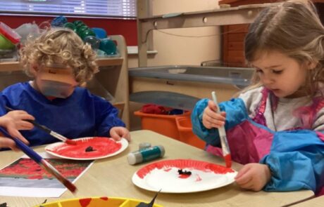 Children making their own poppies at nursery